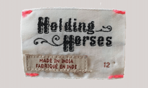 Holding horses label